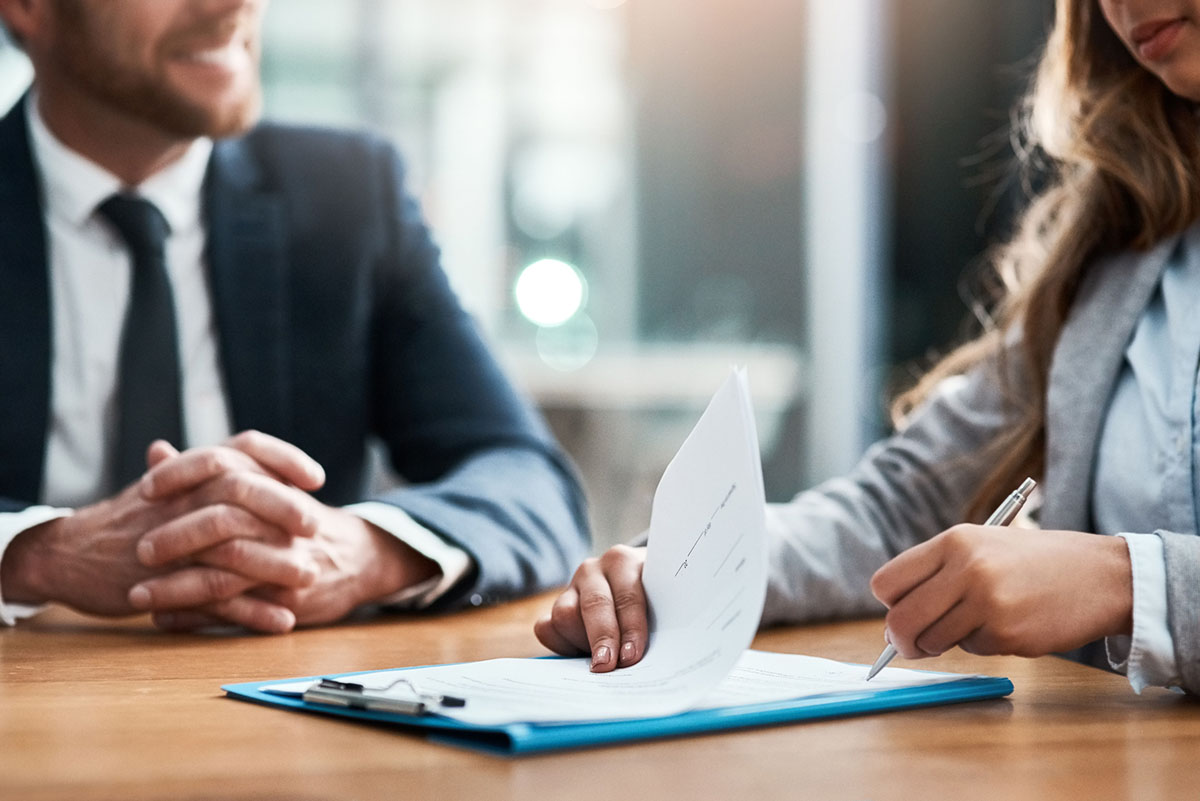 People at a table with paperwork