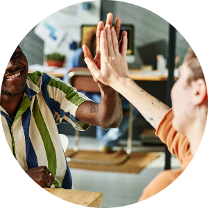 Two colleagues give each other a high five